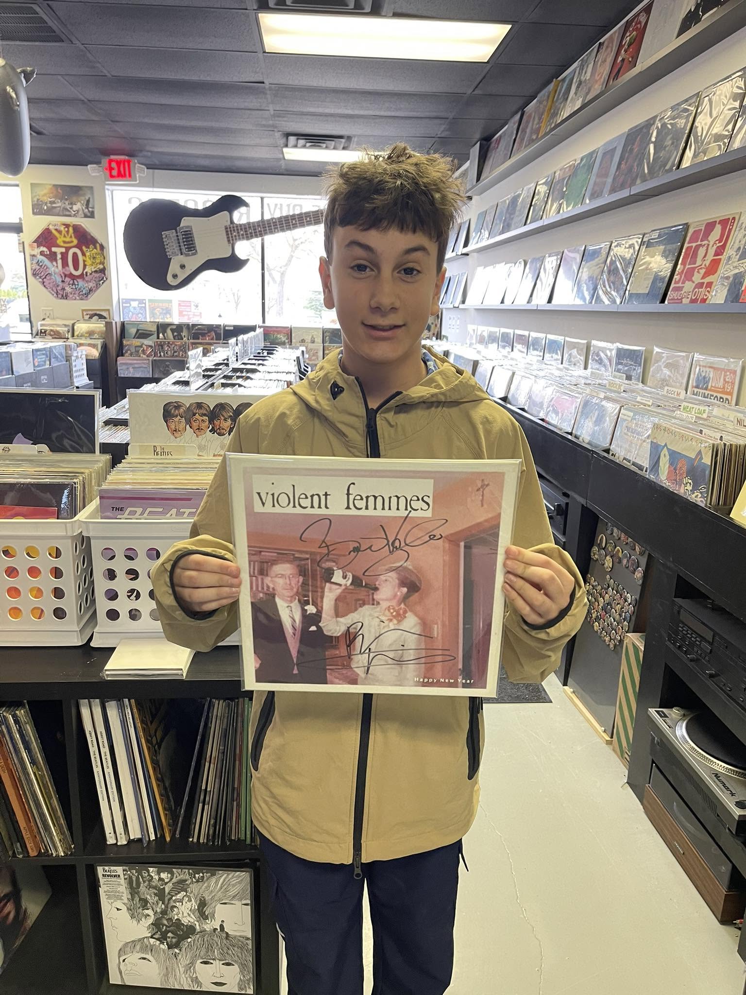 A customer with a record at Vinyl People Records.