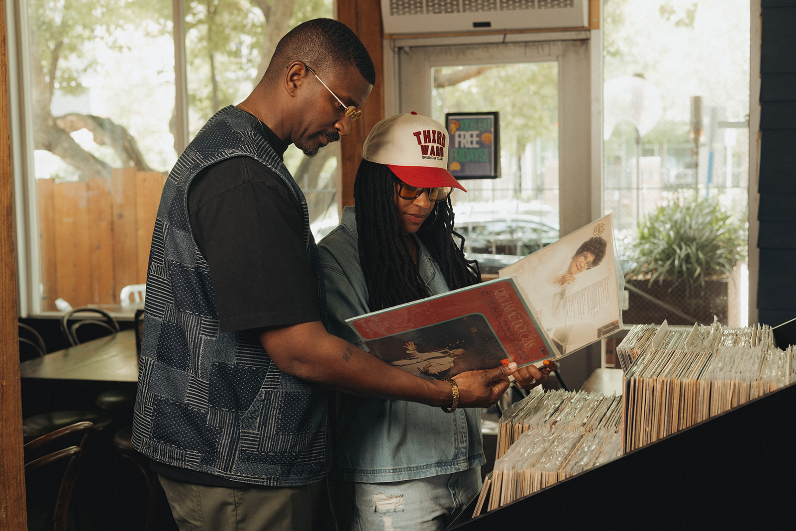 Customers browsing records at Mo' Brunch + Brews