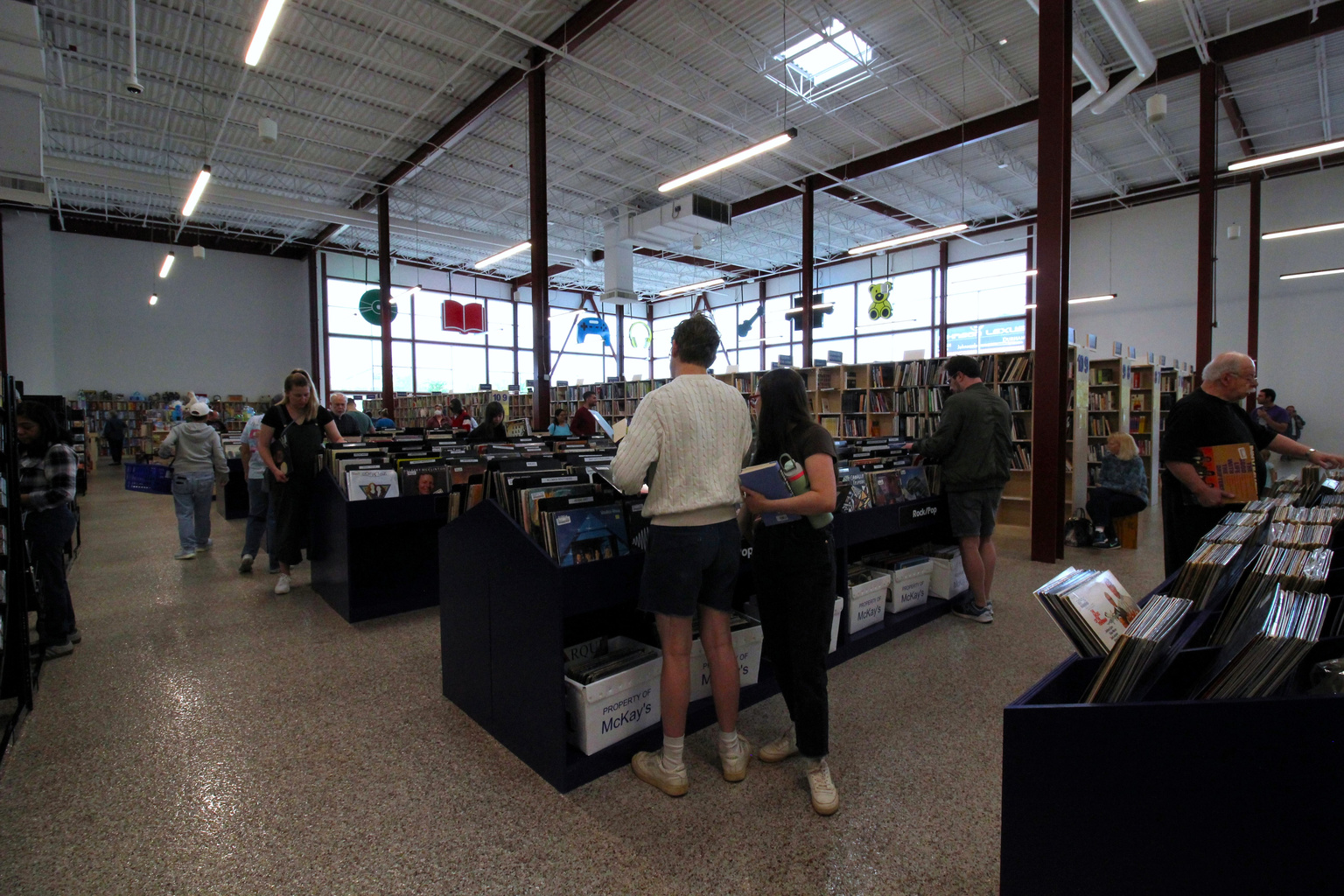 Customers browsing vinyl at McKay's Mebane