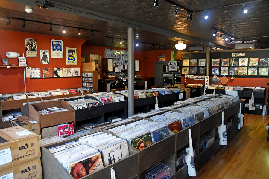 Record bins and wall displays at Analog Vault