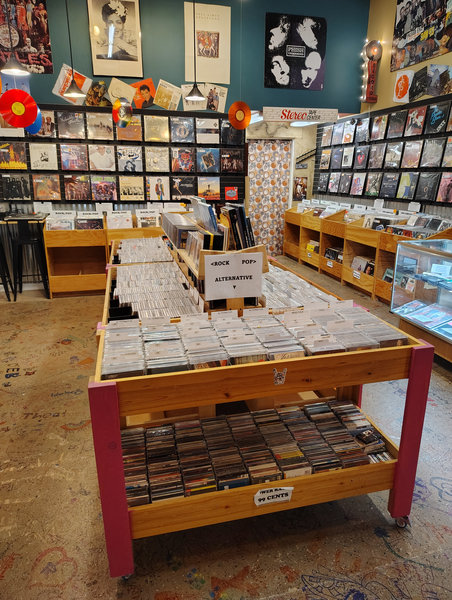 Inside Disc-Cover Records with vinyl bins and wall displays