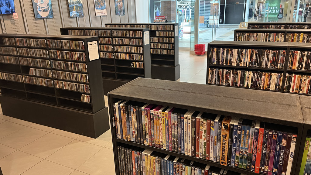 Movie and disc-media shelves at Razzle Dazzle