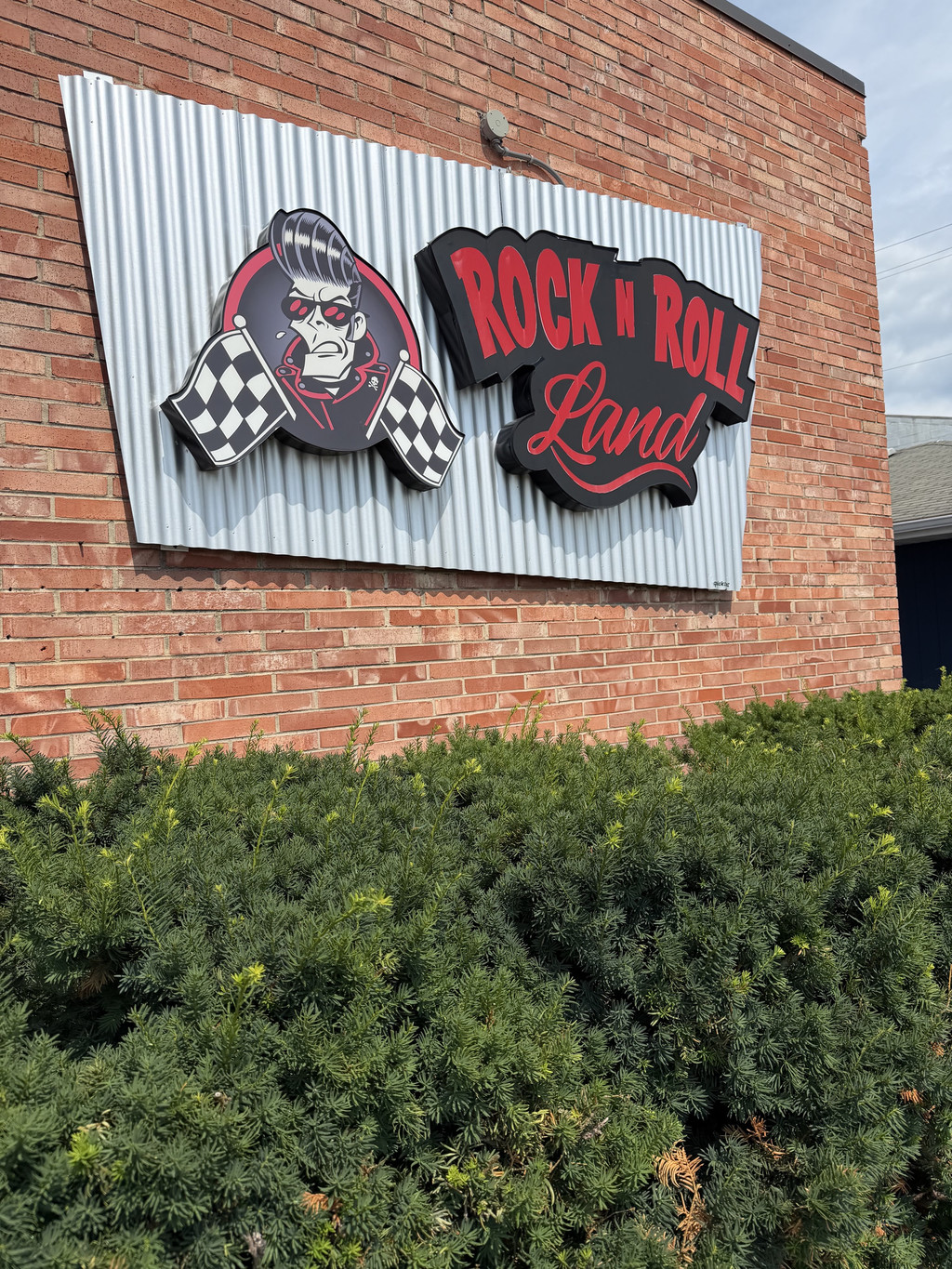 Rock N' Roll Land storefront sign in Green Bay